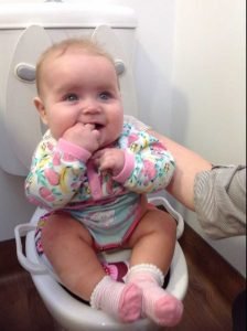baby sitting on toilet elimination communication