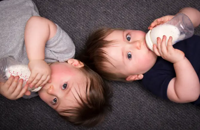 twins bottle feeding