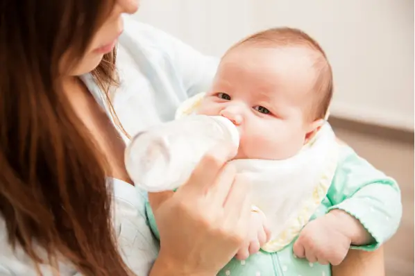 formula feeding tips: sit baby upright