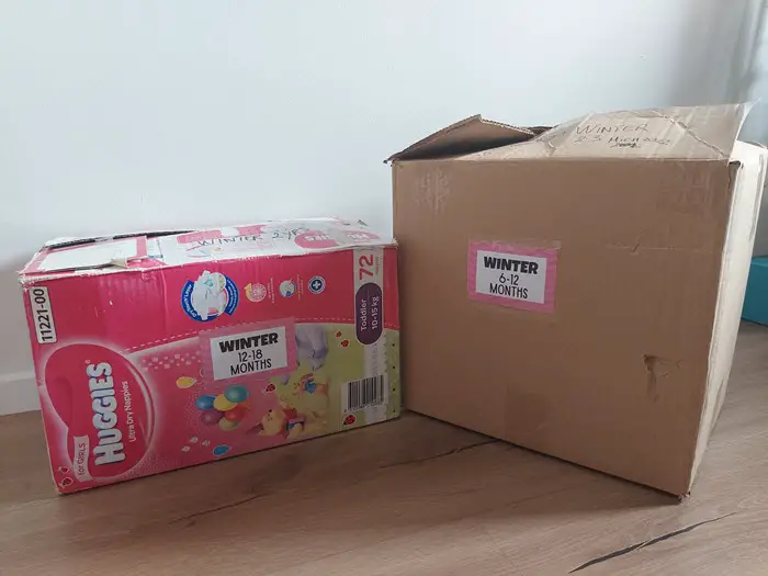 storing baby clothes in carboard boxes