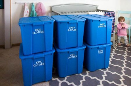 storing baby clothes in plastic storage totes